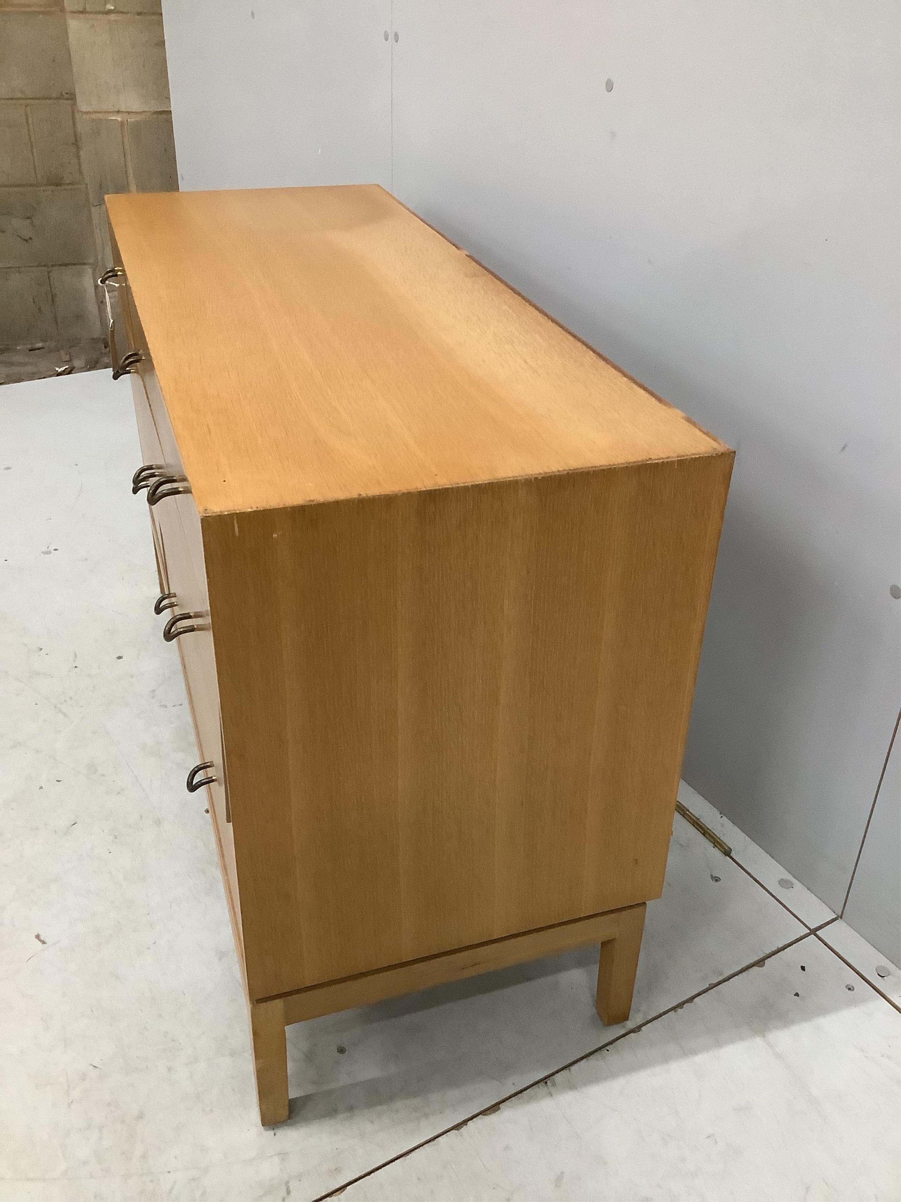 A mid century oak six drawer chest by John and Sylvia Reid, width 112cm, depth 43cm, height 70cm. Condition - fair